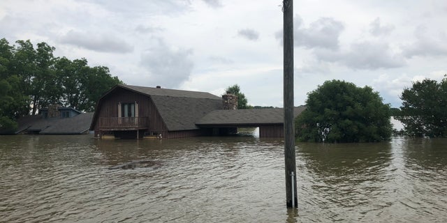 Historic flooding in Arkansas left neighborhoods inundated.