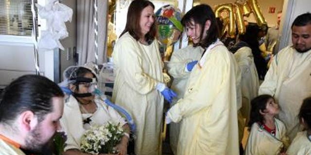 Indiana University Health hospital staffers and relatives of Anna Gonzales gathered for her wedding to fiance Justin Middleton.