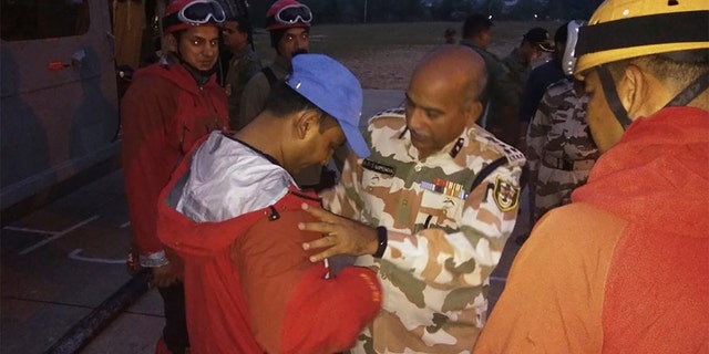 A senior officer sending off soldiers who left to find the climbers in Pithoragarh, India, earlier this month.