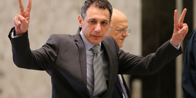Nizar Zakka, a Lebanese citizen and U.S. permanent resident, who was released in Tehran after nearly four years in jail on charges of spying, flashes victory signs upon his arrival at the presidential palace, in Baabda, east of Beirut, Tuesday, June 11, 2019. Zakka a Lebanese businessman was allowed to fly to Lebanon, a development that comes amid heightened tensions between Iran and the U.S. after President Donald Trump withdrew America from Tehran's nuclear deal with world powers.