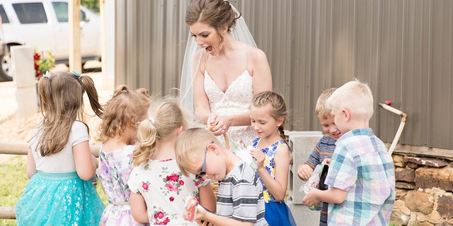 Eight of Geary’s former students surprised their teacher on her big day with hugs, cheers and a lemonade-and-cookie reception.