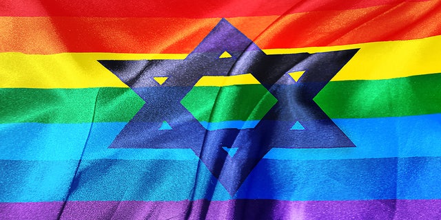 Star of David on a blue and white israeli flag and rainbow-colored LGBT flag