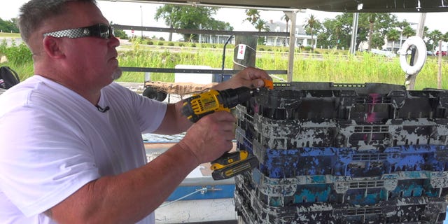 Commercial fishermen, Kevin Black labels his crab baskets during a tough season in the Mississippi Gulf coast. (Fox News/ Charles Watson)