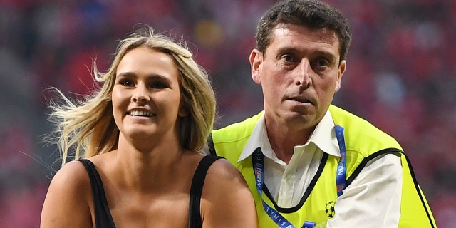 Wolanski is taken off the pitch by security (Photo by Matthias Hangst/Getty Images)
