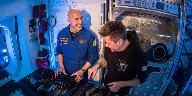 German DJ Le Shuuk (right) teaching Space Station Commander Luca Parmitano (ESA astronaut) (left) how to DJ inside the Columbus Module at the ESA. (Courtesy of BigCityBeats)