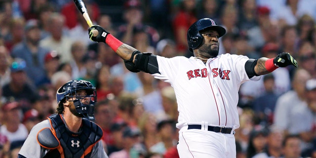 In this July 26, 2016 photo, Boston Red Sox designated hitter David Ortiz and Detroit Tigers catcher Jarrod Saltalamacchia watch Ortiz's three-run home run fly.