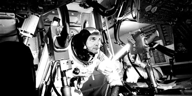 Michael Collins at Apollo 11 Command Module, practicing docking hatch removal from CM simulator at NASA Johnson Space Center, Houston, Texas, June 28, 1969. Image courtesy National Aeronautics and Space Administration (NASA).