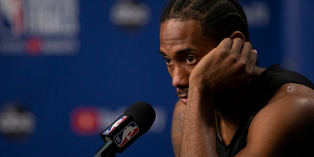 Toronto Raptors' Kawhi Leonard speaks to reporters following practice in Toronto on Sunday, June 9, 2019, ahead of Monday's game five of the NBA basketball Finals against the Golden State Warriors. (Chris Young/The Canadian Press via AP)
