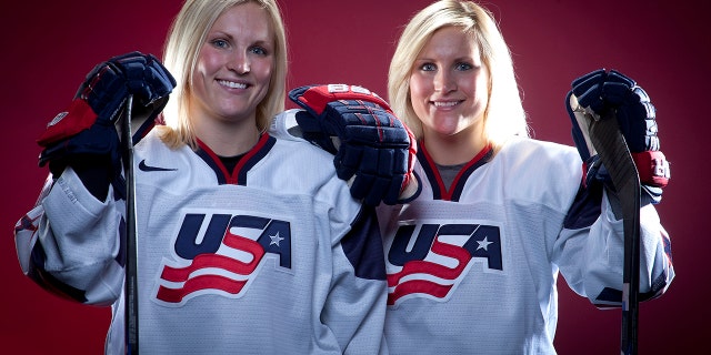 FILE - In this Oct. 2, 2013, file photo, United States Olympic Winter Games Hockey players Jocelyne Lamoureux, left, and Monique Lamoureux pose for a portrait at the Team USA Media Summit in Park City, Utah. (AP Photo/Carlo Allegri, File)