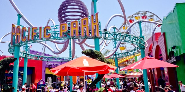 Santa Monica, USA  - May 31, 2013: Pacific Park on Santa Monica Pier, crowds of people eating in cafes located on the famous pier.