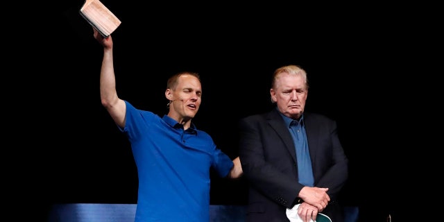 Pastor David Platt, left, prays for President Donald Trump at McLean Bible Church, in Vienna, Va., Sunday June 2, 2019. (AP Photo/Jacquelyn Martin)