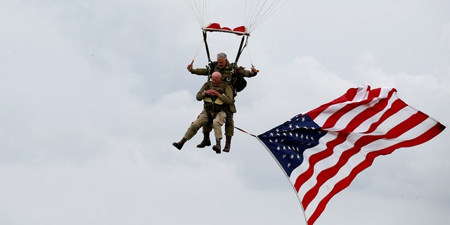 U.S. World War II paratrooper veteran Tom Rice, 97 years-old who served with the 101st Airbone, jumps during a commemorative parachute jump over Carentan on the Normandy coast ahead of the 75th D-Day anniversary, France, June 5, 2019. 