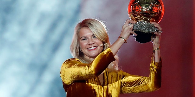 Ada Hegerberg celebrates with the Women's Ballon d'Or award during the Golden Ball award ceremony at the Grand Palais in Paris, France in 2018. (AP Photo/Christophe Ena, File)