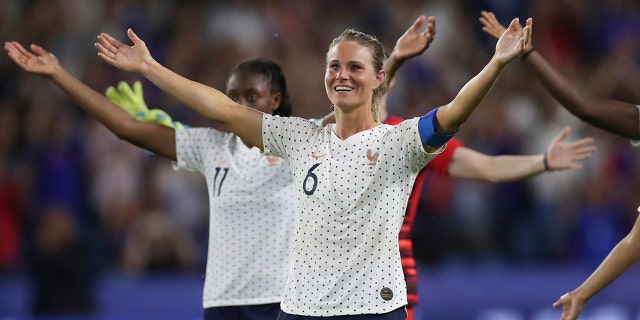 France's Amandine Henry celebrates at the end of the Women's World Cup round of 16 soccer match between France and Brazil at the Oceane stadium in Le Havre, France, Sunday, June 23, 2019. France beat Brazil 2-1. (AP Photo/Francisco Seco)