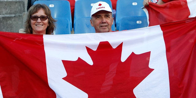 Canadian fans wait for the start of the Women's World Cup Group E soccer match between Canada and Cameroon in Montpellier, France, Monday, June 10, 2019. (AP Photo/Claude Paris)