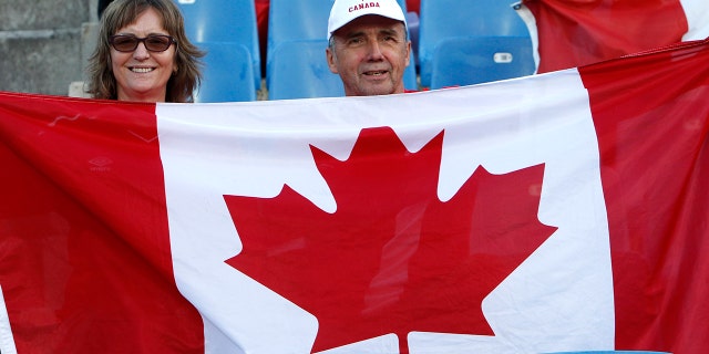 Canadian fans wait for the start of the Women's World Cup Group E soccer match between Canada and Cameroon in Montpellier, France, Monday, June 10, 2019. (AP Photo/Claude Paris)