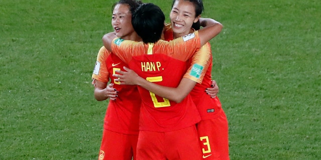China's Wu Haiyan, China's Han Peng, and China's Lin Yuping, from left to right, celebrate their 1-0 win at the end of the Women's World Cup Group B soccer match between China and South Africa at the Parc des Princes in Paris, France, Thursday, June 13, 2019. (AP Photo/Thibault Camus)