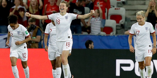 England's Ellen White, front, celebrates after scoring her side's second goal during the Women's World Cup Group D soccer match between Japan and England at the Stade de Nice in Nice, France, Wednesday, June 19, 2019. (AP Photo/Claude Paris)