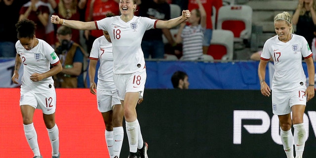 England's Ellen White, front, celebrates after scoring her side's second goal during the Women's World Cup Group D soccer match between Japan and England at the Stade de Nice in Nice, France, Wednesday, June 19, 2019. (AP Photo/Claude Paris)