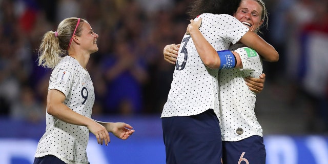France's Amandine Henry, right, celebrates with France's Wendie Renard, center, and France's Eugenie Le Sommer after scoring her side's 2nd goal during the Women's World Cup round of 16 soccer match between France and Brazil at the Oceane stadium in Le Havre, France, Sunday, June 23, 2019. (AP Photo/Francisco Seco)