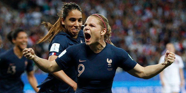 France's Eugenie Le Sommer, celebrates with France's Amel Majri after scoring her side's second goal on a penalty kick during the Women's World Cup Group A soccer match between France and Norway in Nice, France, Wednesday, June 12, 2019. (AP Photo/Claude Paris)