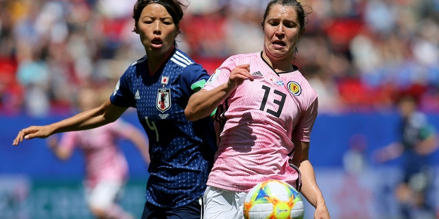 Scotland's Jane Ross, right, is challenged by Japan's Saki Kumagai during the Women's World Cup Group D soccer match between Japan and Scotland at the Roazhon Park in Rennes, France, Friday, June 14, 2019. (AP Photo/David Vincent)