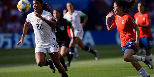 United States' Jessica Mcdonald, left, runs after the ball next to Chile's Carla Guerrero during the Women's World Cup Group F soccer match between United States and Chile at Parc des Princes in Paris, France, Sunday, June 16, 2019. (AP Photo/Alessandra Tarantino)
