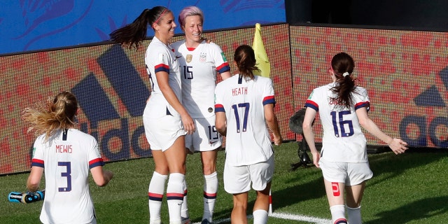 United States' Megan Rapinoe, center, celebrates with teammates after scoring her side's second goal from the penalty spot during the Women's World Cup round of 16 soccer match between Spain and United States at Stade Auguste-Delaune in Reims, France, Monday, June 24, 2019. (AP Photo/Thibault Camus)