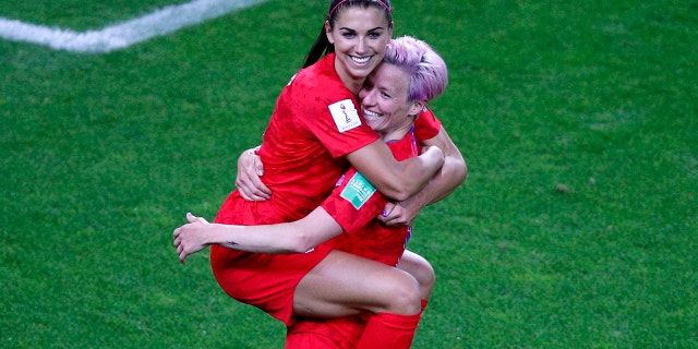 United States' Megan Rapinoe, right, congratulates teammate Alex Morgan after scoring her fifth goal during the Women's World Cup Group F soccer match between the United States and Thailand at the Stade Auguste-Delaune in Reims, France, Tuesday, June 11, 2019. (AP Photo/Francois Mori)