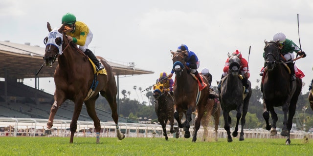 Vasilika and jockey Flavien Prat, left, compete in the Grade I, Gamely Stakes at Santa Anita Park in Arcadia, Calif., Monday, May 27, 2019.