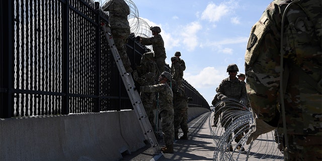 Army engineers install concertina wire on Nov. 5, 2018, on the Anzalduas International Bridge, Texas. (US Air Force photo by Airman First Class Daniel A. Hernandez)