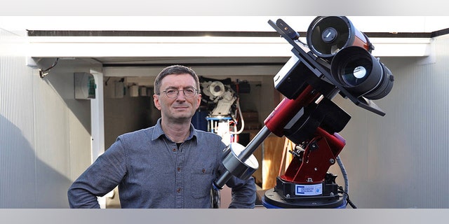 Professor Hakan Kayal next to the moon telescope. (Credit: Tobias Greiner / Universität Würzburg)