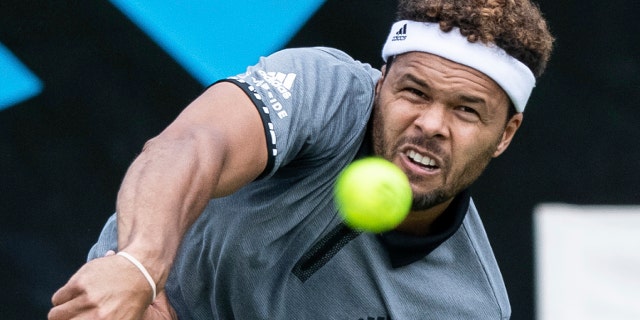 Jo-Wilfried Tsonga serves the ball to Mischa Zverev during their first round match at the ATP tennis tournament in Stuttgart, Germany, Monday, June 10, 2019. (Silas Stein/dpa via AP)