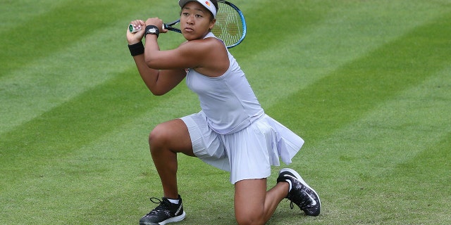 Japan's Naomi Osaka returns to Greece's Maria Sakkari during day four of the Nature Valley Classic at Edgbaston Priory Club, Birmingham, England, Tuesday, June 18, 2019. (David Davies/PA via AP)