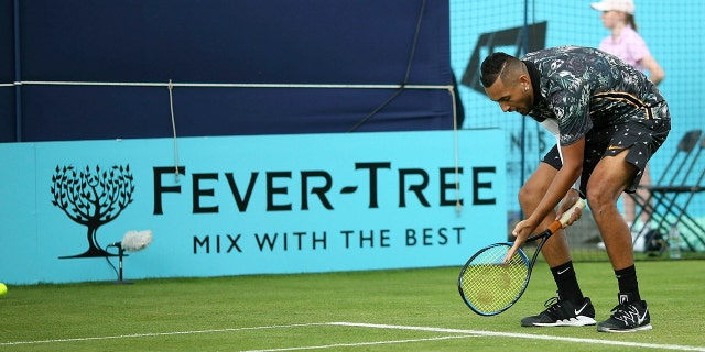 Australia's Nick Kyrgios appeals to the umpire on court one during his tennis match against Spain's Roberto Carballes Baena day four of the Fever-Tree Championship at the Queen's Club, London. (Steven Paston/PA via AP)