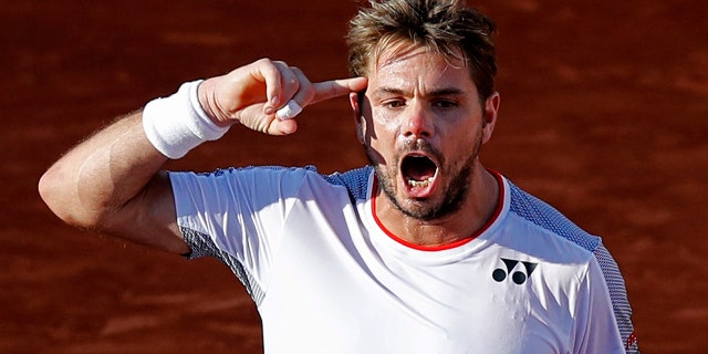 Switzerland's Stan Wawrinka won it all in 2015. (AP Photo/Christophe Ena )
