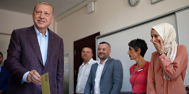 Turkey's President Recep Tayyip Erdogan casting his ballot Sunday. (AP Photo/Emrah Gurel)