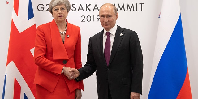 Britain's Prime Minister, Theresa May, offered an icy greeting to Russia's President, Vladimir Putin, during a bilateral meeting on the first day of the G20 summit Friday in Osaka, Japan. (Photo by Carl Court/Getty Images)