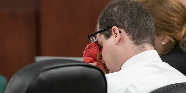 Timothy Jones Jr. wiping his eyes as his ex-wife, Amber Kyzer, testified Tuesday. (Tracy Glantz/The State via AP, Pool)