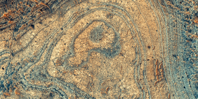 An image of the Martian mineral that scientists now think may have been created by volcanic eruptions, as seen from orbit.