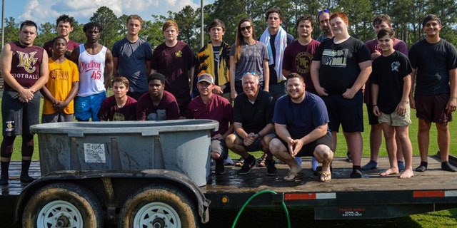 18 football players at Washington County High School in Chatom, Ala. were baptized last month near the field, which upset an atheist group demanding an investigation into "illegal" activities.