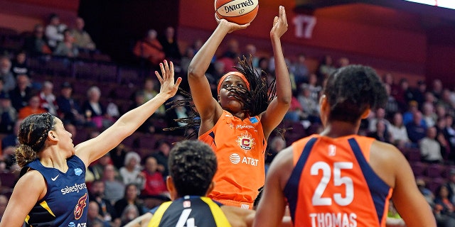 FILE - In this May 28, 2019, file photo, Connecticut Sun center Jonquel Jones shoots over the Indiana Fever defense during a WNBA basketball game, in Uncasville, Conn. Led by Jones, the Sun (8-1) have won their last six games and have started to put a little distance between themselves and the rest of the league. (Sean D. Elliot/The Day via AP, File)