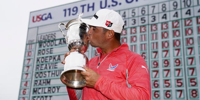 Gary Woodland posses with the trophy after winning the U.S. Open Championship golf tournament Sunday, June 16, 2019, in Pebble Beach, Calif. (AP Photo/Carolyn Kaster)