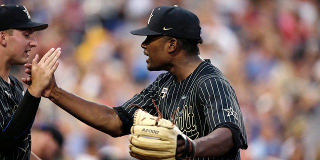Vanderbilt pitcher Kumar Rockeer reacts at the end of the sixth inning against Michigan in Game 2 of the NCAA College World Series baseball finals in Omaha, Neb., Tuesday, June 25, 2019. (AP Photo/Nati Harnik)