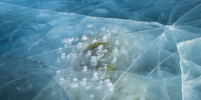 Frozen bubbles of methane locked beneath Lake Baikal.