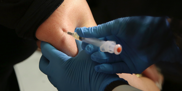 FILE - In this March 27, 2019 file photo, a woman receives a measles, mumps and rubella vaccine at the Rockland County Health Department in Pomona, N.Y., north of New York City. On Wednesday, June 5, 2019, federal health officials updated the U.S. measles case count, saying 1,001 illnesses have been reported since the beginning of the year. (AP Photo/Seth Wenig)