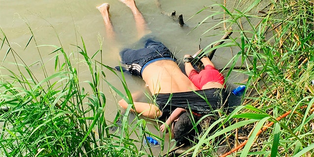 The bodies of Salvadoran migrant Oscar Alberto Martínez Ramírez and his nearly 2-year-old daughter Valeria lie on the bank of the Rio Grande in Matamoros, Mexico, on Monday. (AP)