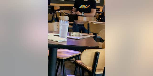 Alisha Norman, who was visiting Los Angeles from Texas, was getting ready to order at the chain restaurant when she heard something crawling above her.