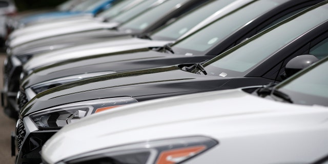 FILE - In this May 19, 2019, file photo, a line of unsold 2019 Tucson sports-utility vehicles sits at a Hyundai dealership in Littleton, Colo. 