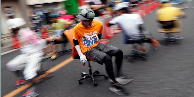Racers compete in an office chair race in Hanyu, Japan, on Sunday.